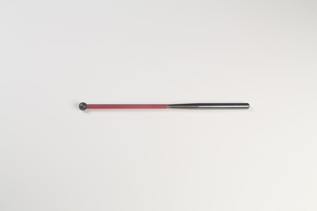 Metal cylinder shaped like a baseball bat with a small black knob at the end  and red tubing for grip.