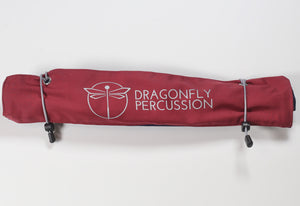 Red roll-bag closed.  Grey Dragonfly Percussion logo on outside.  2 grey elastic closures.