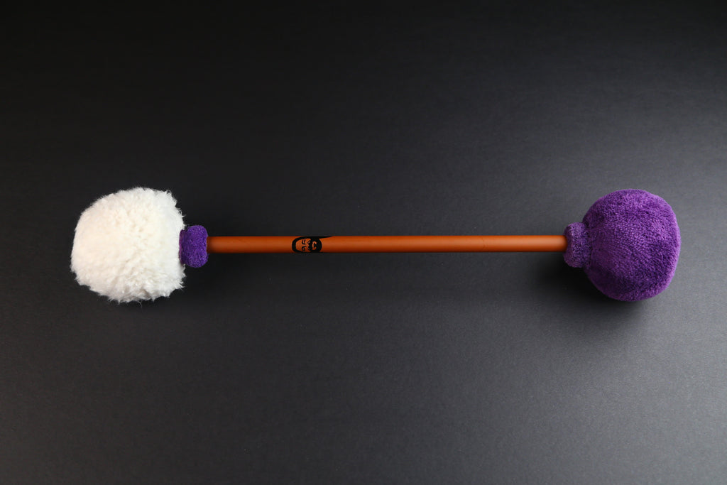 Mike Tamburo Double-Ended Mallet.  Bronze-colored carbon fiber handle with one head covered in white sherpa and the other covered in minky purple.