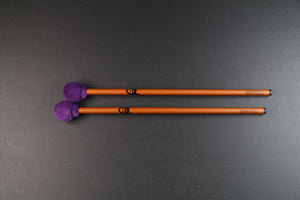 Mike Tamburo Utlitly mallets - a pair of bronze-colored carbon fiber handles with Mike Tamburo's face printed on them.  Heads are small and round and wrapped in purple minty fabric.
