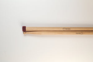 Soft flannel swizzles - Concert General drumsticks with a small head on the butt end made of stacked discs of red flannel.