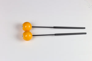 Billiards Ball bell mallets - yellow billiards balls on top of black fiberglass handles with black tubing for grips.