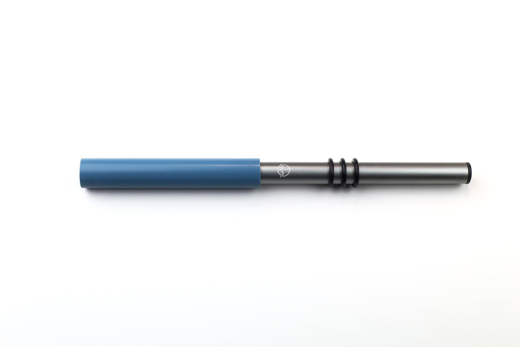 Medium Silicone Wand - blue silicone tube at the end of a silver tube handle with 3 black rings for grip.