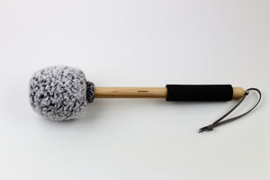 Fuzzbucket gong mallet on Maple handle.  Grey sherpa wrapped with a black foam grip and string for hanging.