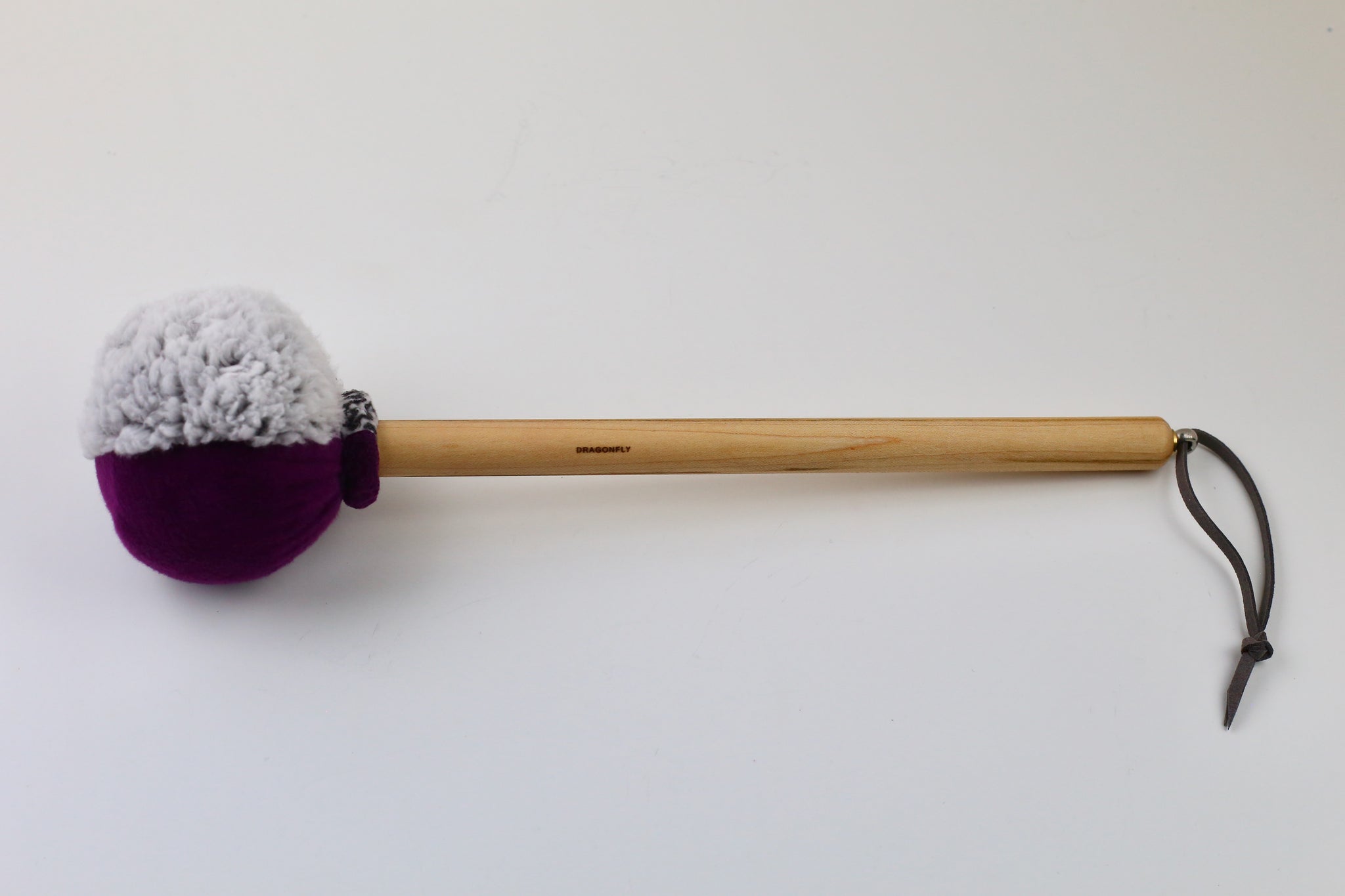 2-sided gong mallet on Maple handle.  Head is wrapped in grey sherpa and purple fleece.  String for hanging.