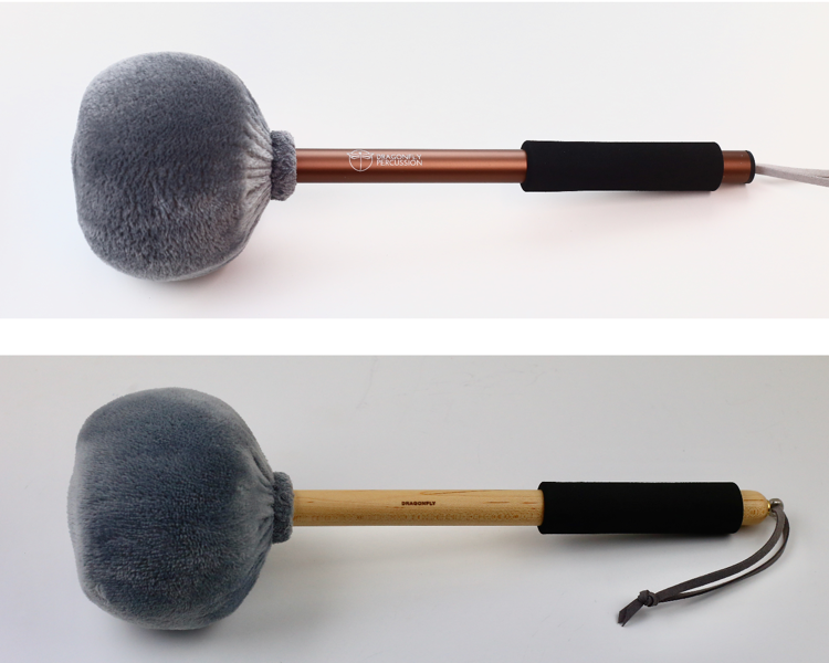 XL Gong mallet on two different handles.  Both mallets have a large head wrapped in grey minky fabric.  The top mallet has a bronze-colored aluminum handle and the bottom has a wooden handle.  Both have a black foam grip and strings for hanging.