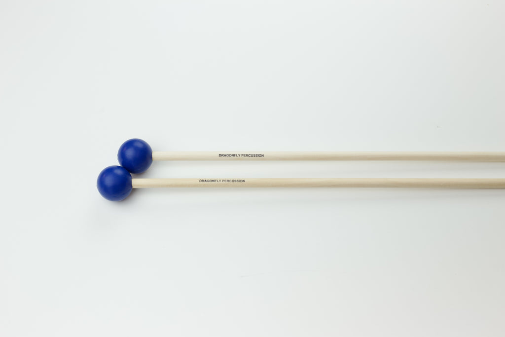 Pair of marimba mallets.  Heads are blue and round on birch handles.
