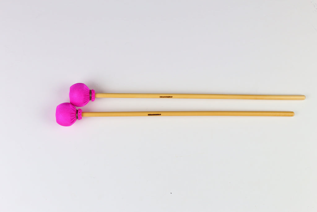 Soft Solo Xylophone mallets on rattan handles.  Pink spandex wrapped heads.