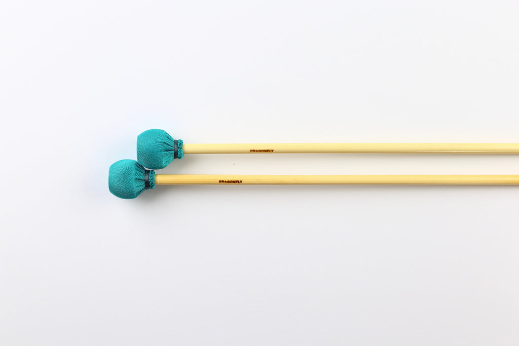 Medium vibraphone mallets with rattan handles and teal spandex wrap.